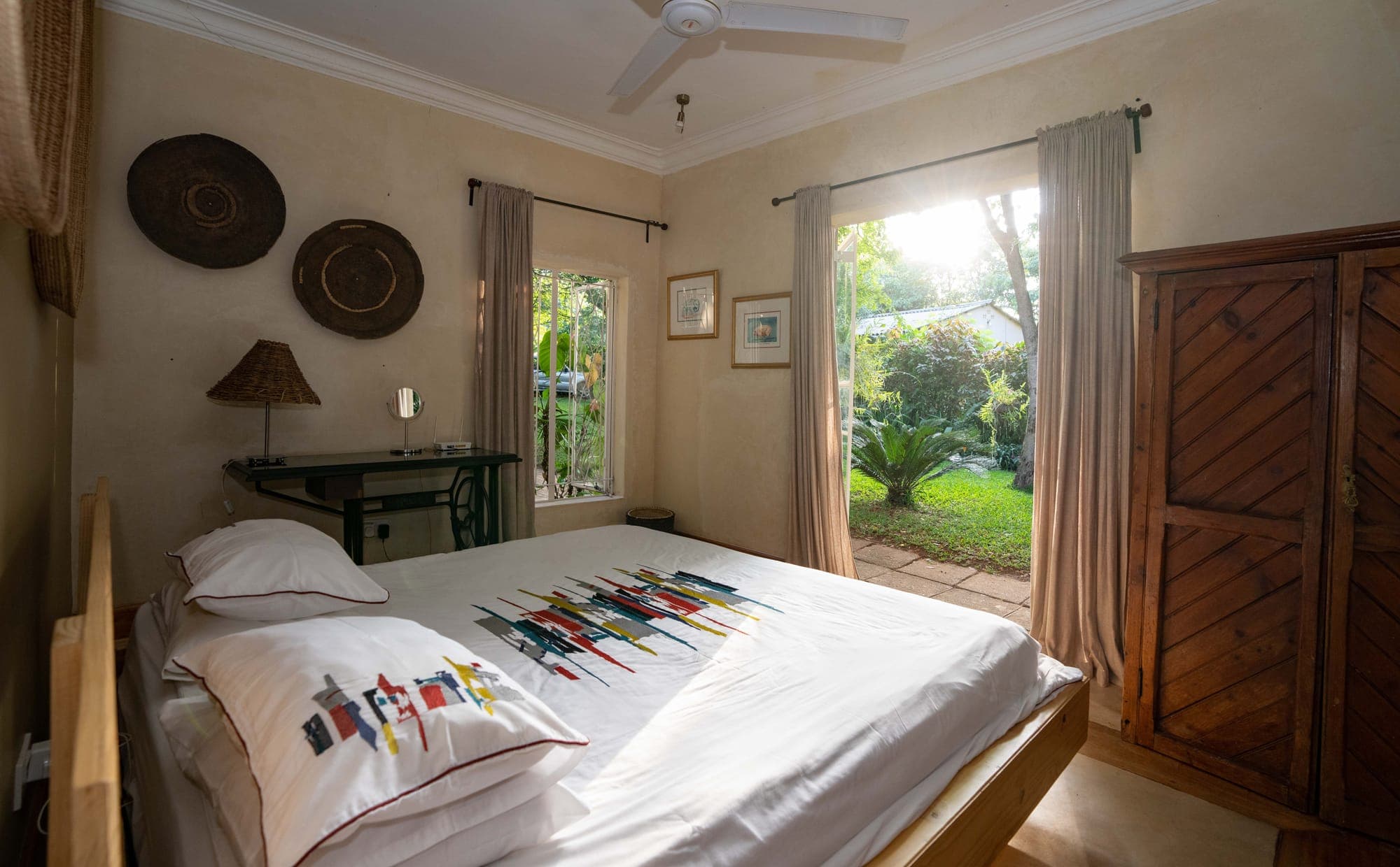 King bedroom opening onto the garden at The Art House